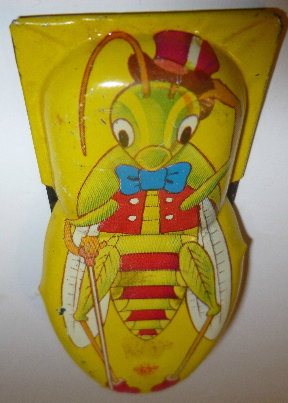 tin clicker toy