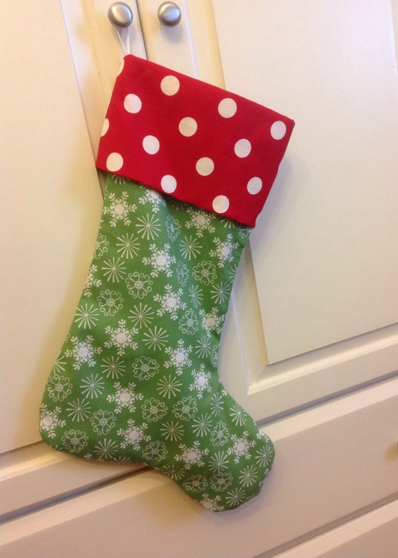 Red polka dot and Green Snowflake Christmas Stocking by shoppr88