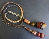 Dwale. Rustic tribal organic lariat in shades of brown and russet.