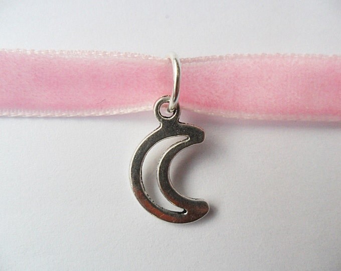 Pink velvet choker necklace with moon pendant and a width of 3/8" inch.
