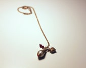 Vintage Tibetan charm pendant, brass heart charm and red Swarovski crystals on a brass chain