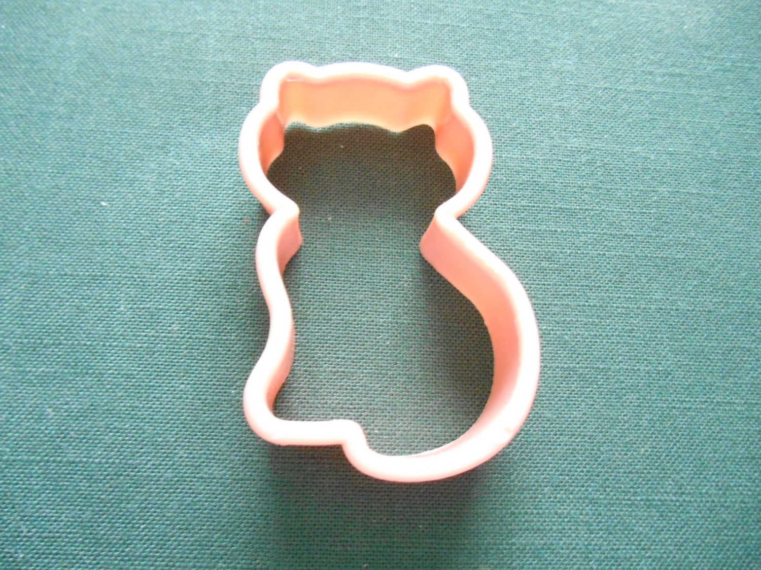 A Hard Plastic Cookie Cutter in the Shape of a Kitten. Makes a
