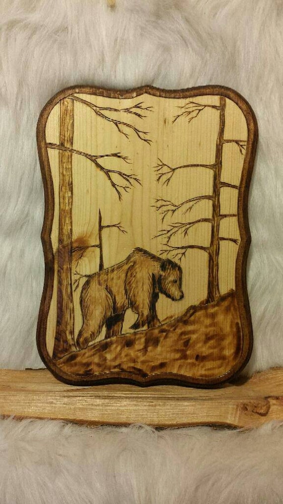 Wood burned Brown Bear nature scene.