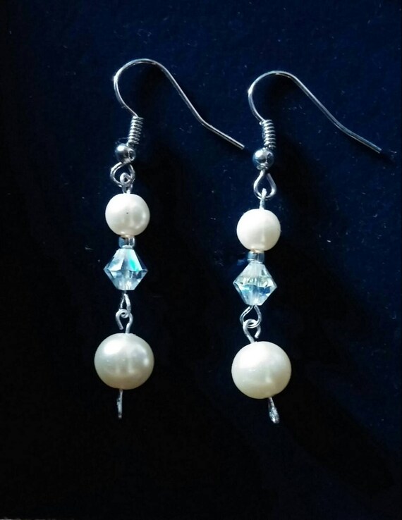 Items similar to Swarovski crystal and pearl gorgeous dangle earrings ...