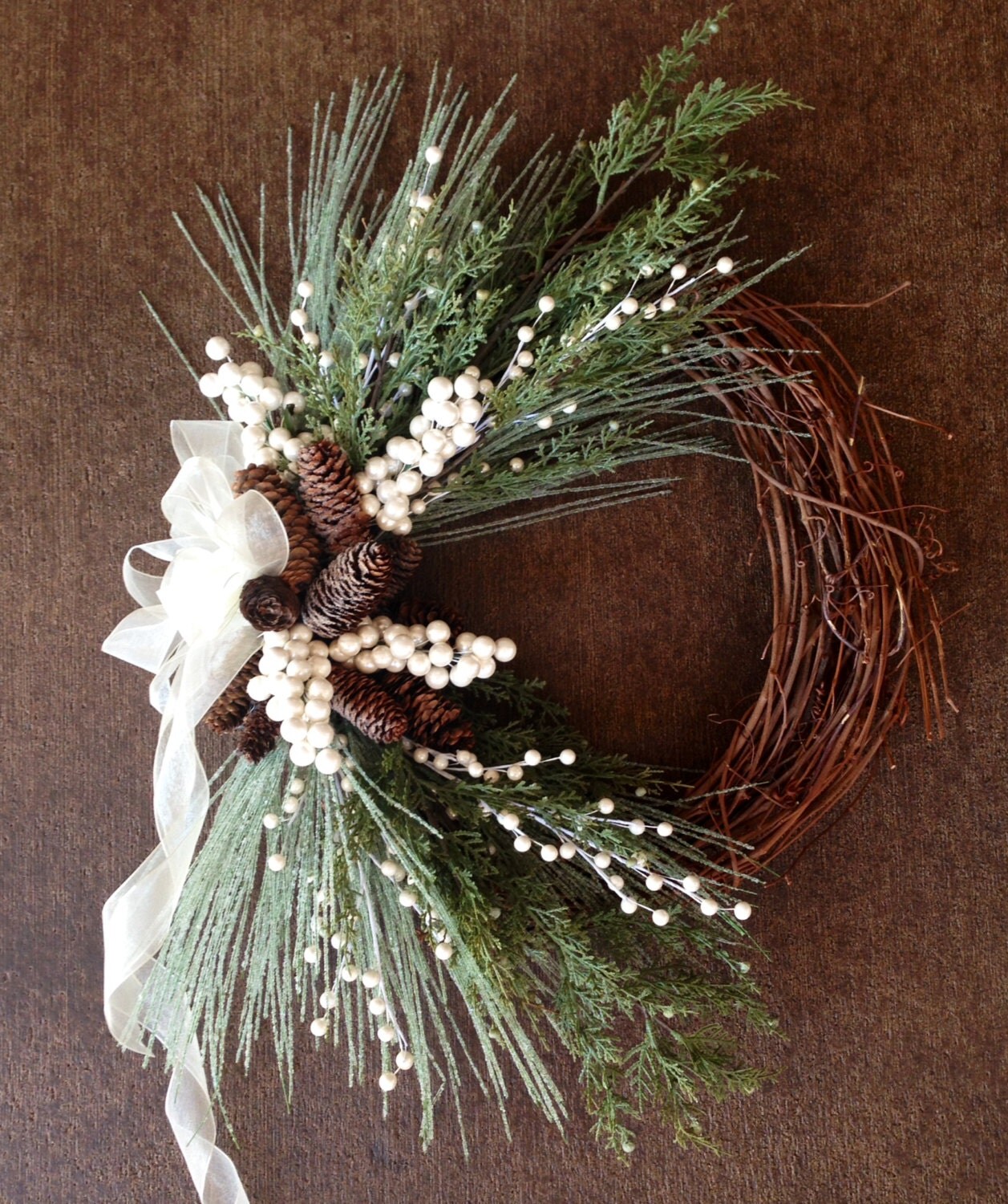 Elegant winter grapevine wreath made with evergreen iced