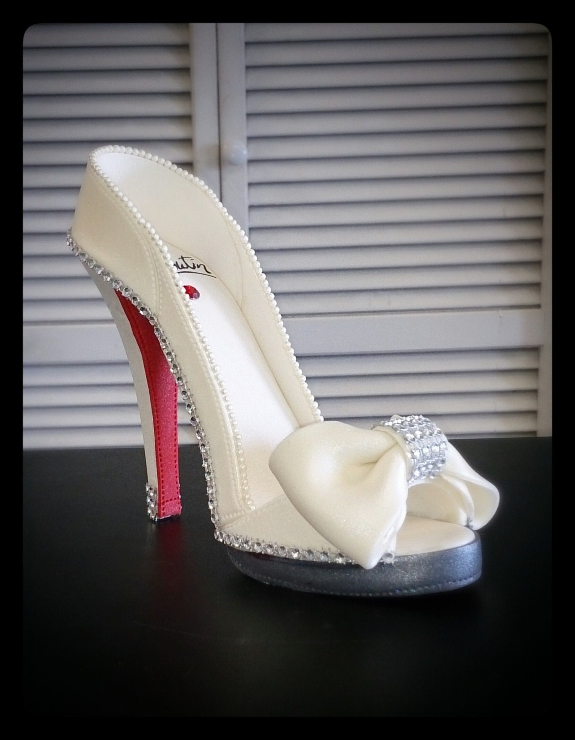 Louboutin Edible High Heel in white with bow colors can be