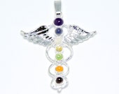 angel with wings holding blue amethyst pendant