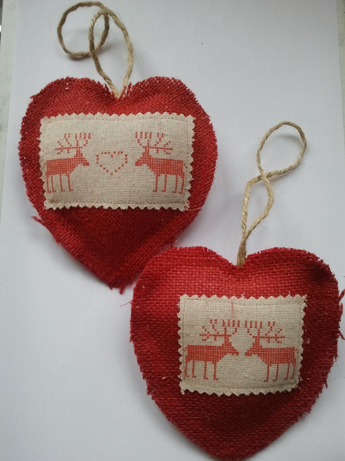 2 rough cut Rustic red hessian heart shaped Christmas tree hanging decorations with reindeer designs