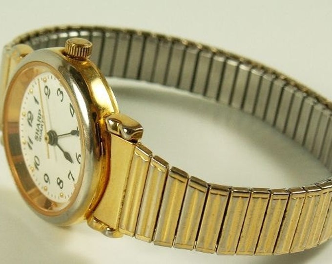 Storewide 25% Off SALE Lovely Vintage Ladies Sharp quartz watch in gold tone metal band with twist-a-flex band