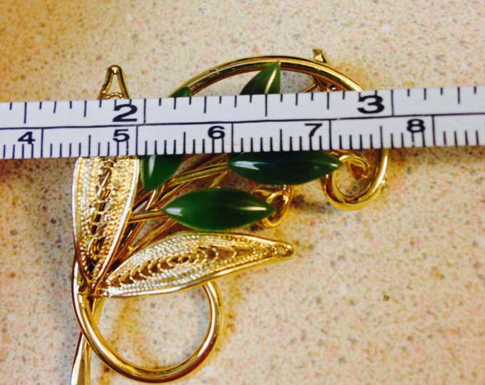 Storewide 25% Off SALE Beautiful vintage 2" goldtone and jade brooch featuring a swirling stem and openwork leaf design with marquis jade st