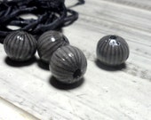 Enamel bead , torch-fired bead. Gray.