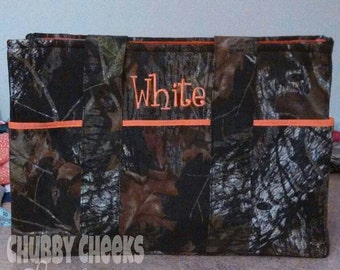 Boy or girl camouflage and orange diaper bag.