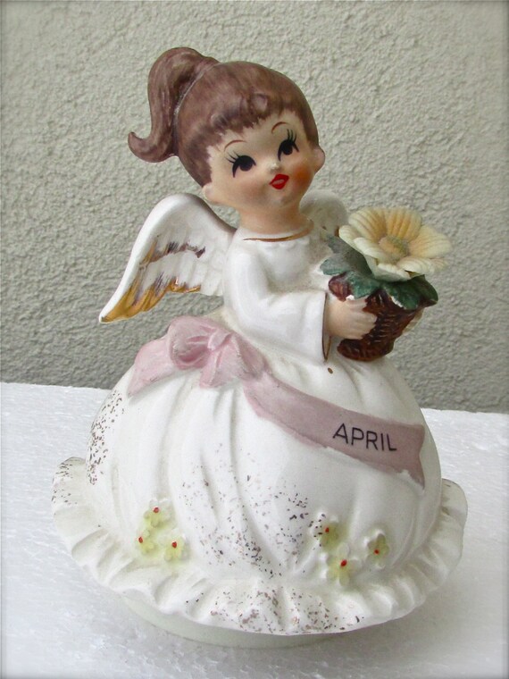 Vintage musical figurine plays Happy Birthday