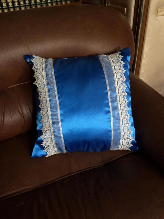 Blue satin pillow with white lace