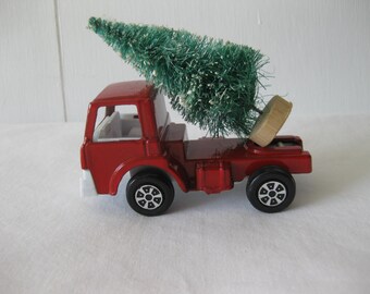 1970 Tootsie Toy Truck With A Bottlebrush Tree