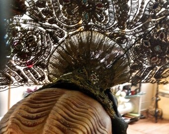 An 1800s hair adornment in metallic gold bouillon with jewels and silk trailings
