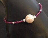 South sea carved pearl bracelet with silver and garnets