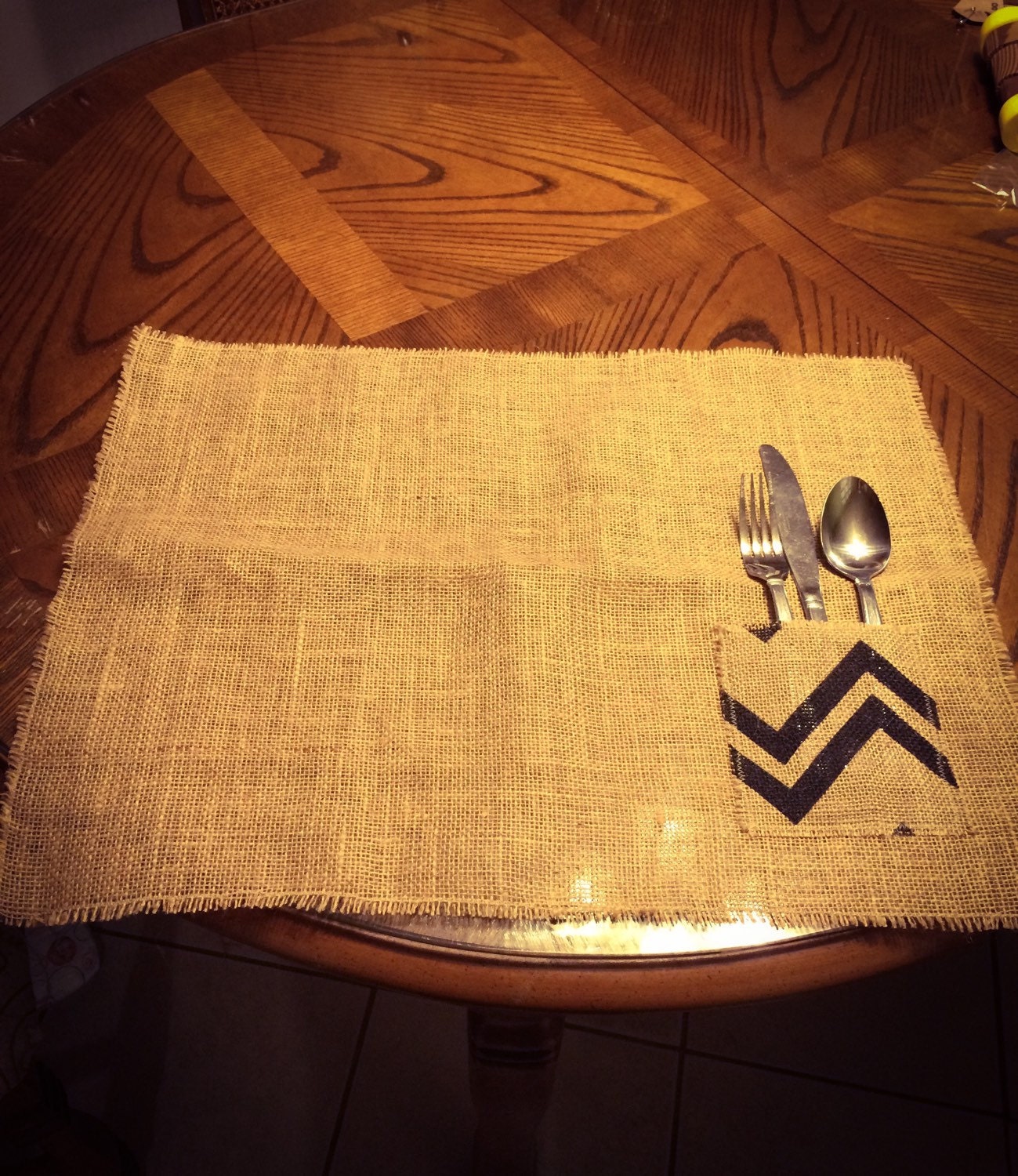 Placemat with attached utensil holder