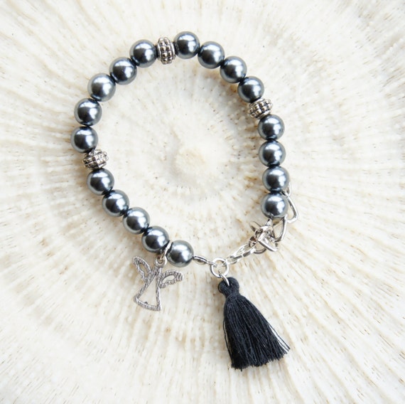 Items similar to Tassel angel charm bracelet, Silver accented beads