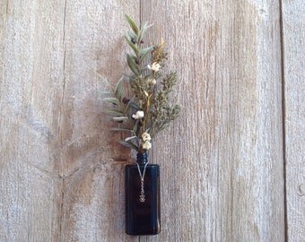 Antique Bottle Filled with Wintery Greens & Berries.