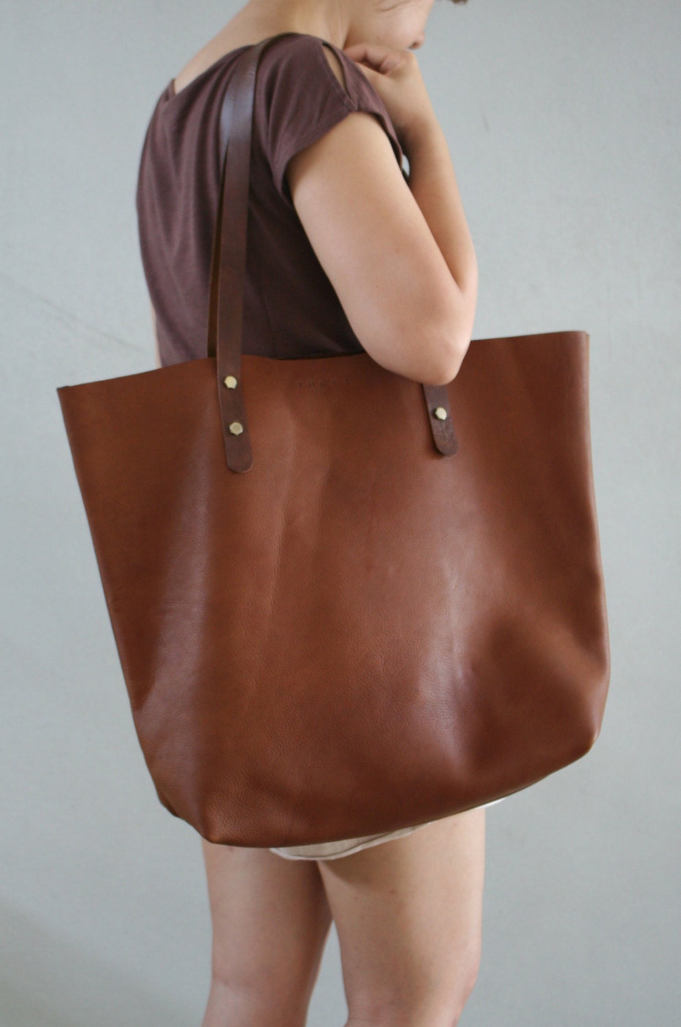 next tan leather handbag