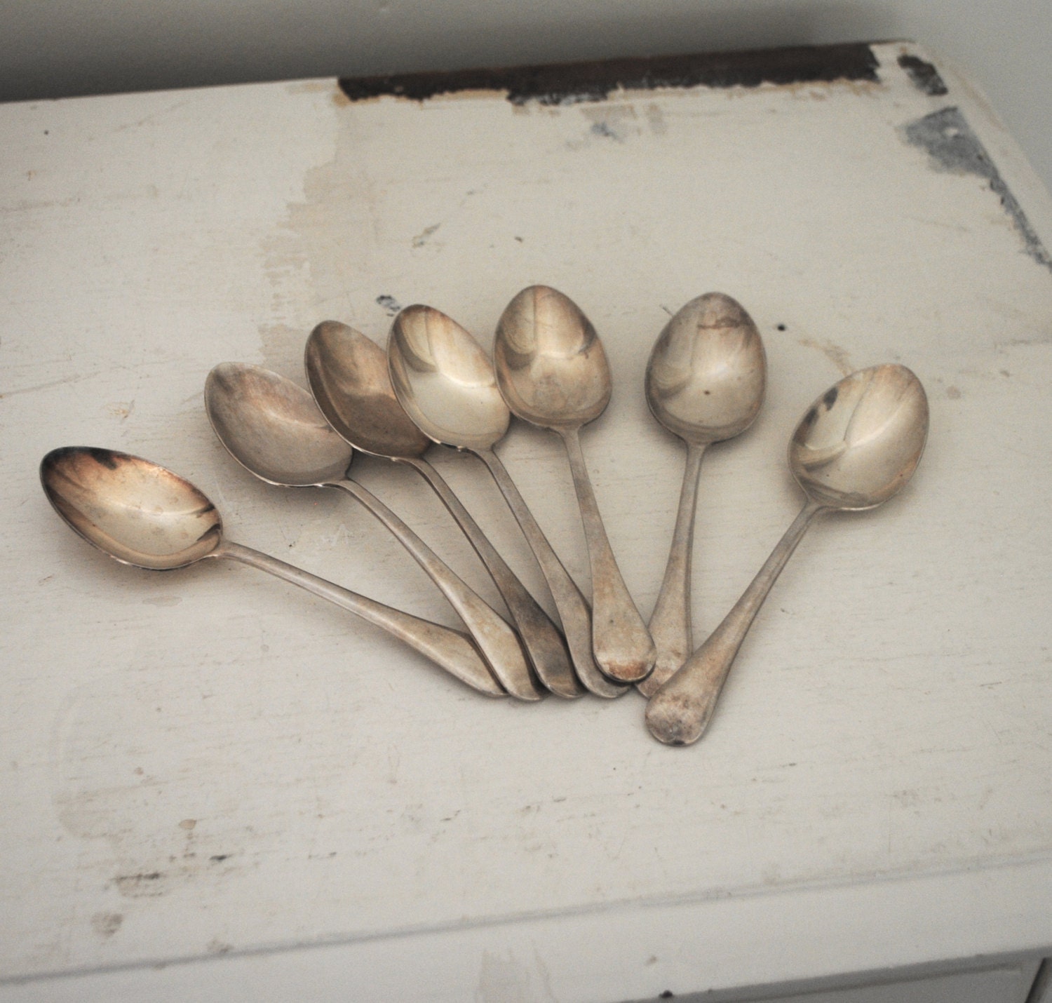 Seven VINTAGE silver GROSVENOR plate desert spoons. VINTAGE kitchen