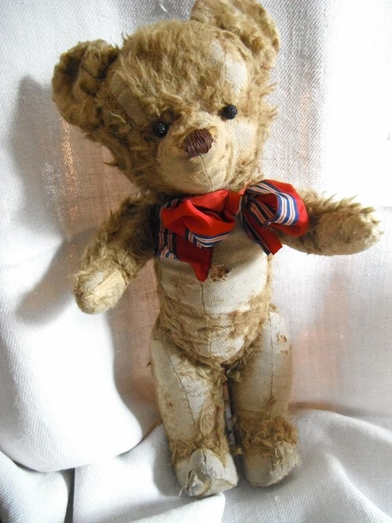 teddy bear with wooden face