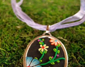 Polymer clay Medallion necklace oval climbing flowers.