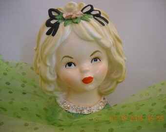 Collectible LADY HEAD VASE 5.75" tall A Blonde Girl wearing Green, White, Gold, Blouse Flowers Trimmed in Black Ribbon in her Hair
