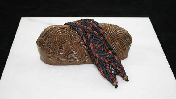 Leather Celtic bracelet in blacks, blues, and browns
