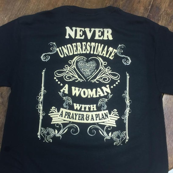 Never Underestimate A Woman with a Prayer & A Plan by TMIshirts