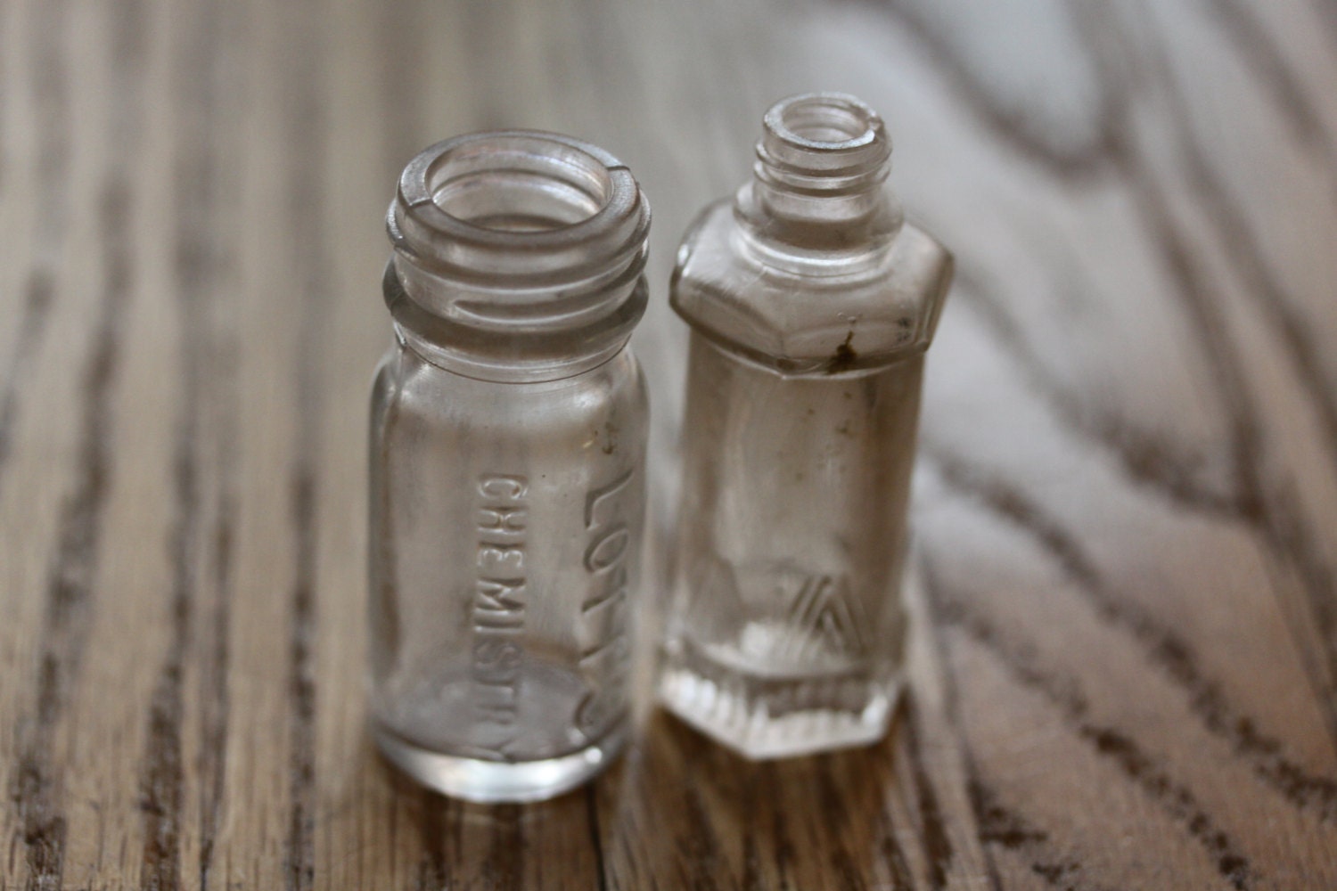 Two very small antique glass bottles