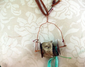Concrete vertebrae necklace with found objects