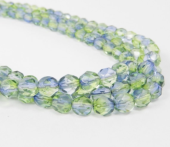 Items similar to Blue and green glass bead necklace on stainless steel ...