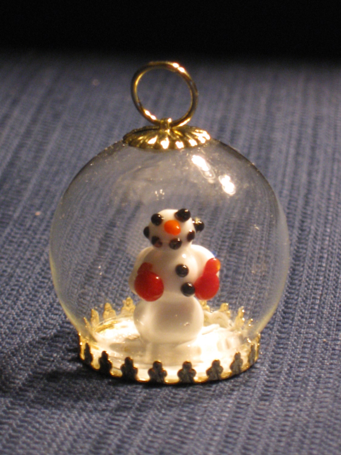 One of a kind tree ornament with hand crafted lampwork glass snowman in blown glass globe