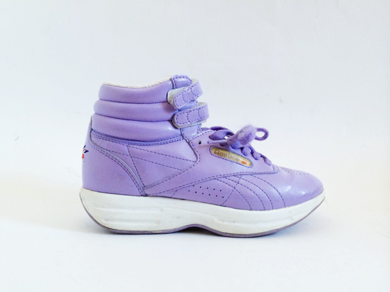 purple reebok high tops