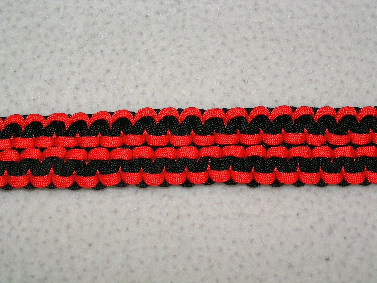 Double Cobra Stitch Paracord Gun Sling Black and Neon Orange