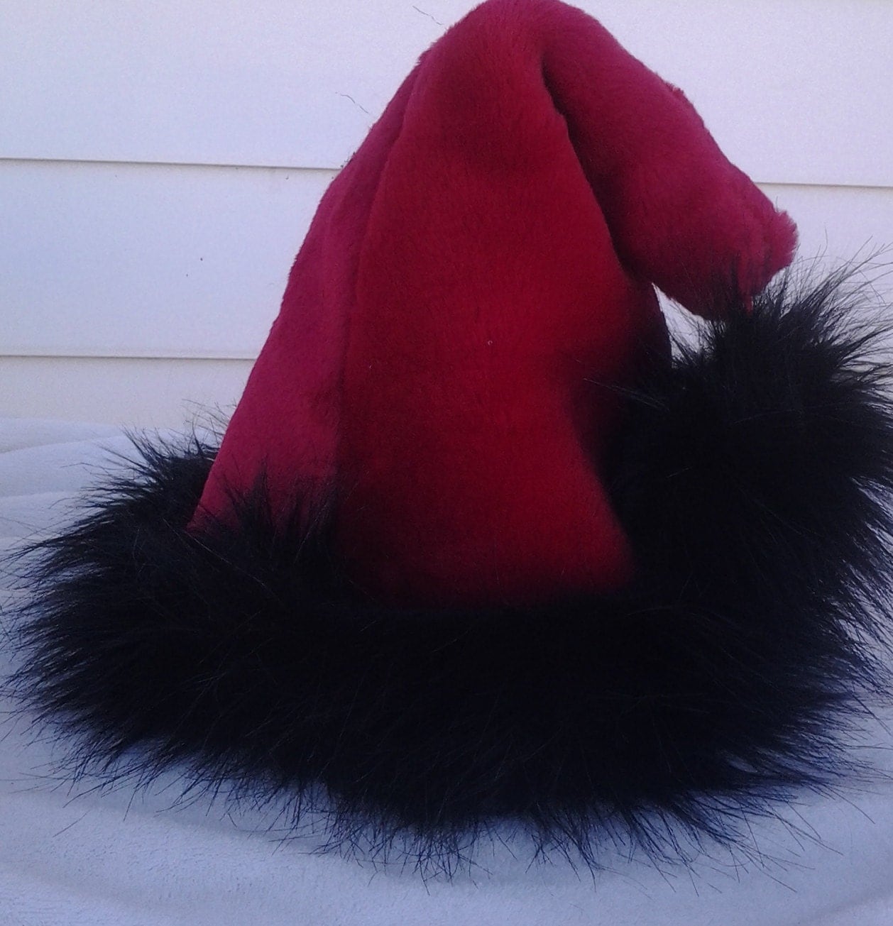 red santa hat with long black fur trim red santa hat with long black fur trim