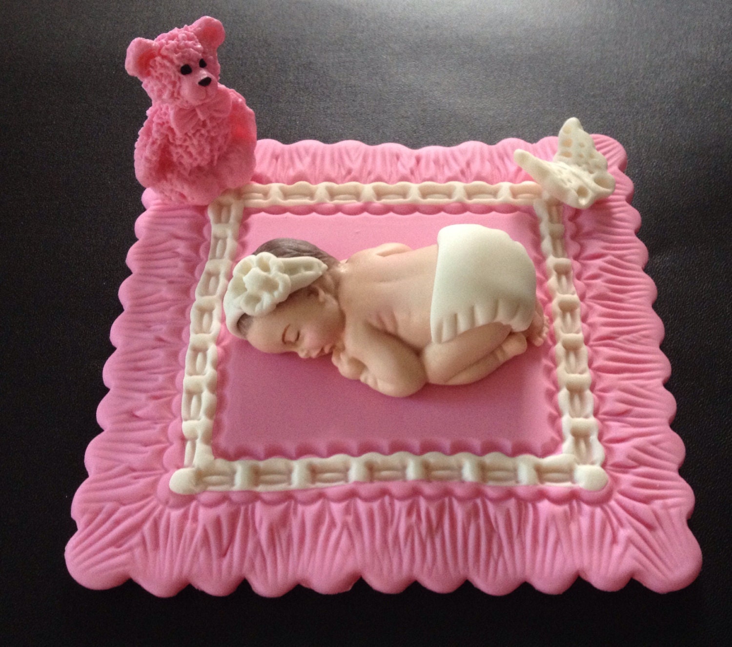 Fondant baby girl on a pink blanket cake topper Baby shower