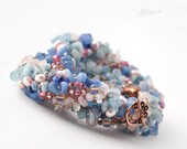 Multi-Colored Necklace. Seed beads, rose quartz, Aquamarine and jade. Freshwater pearls and copper. Massive necklace with beads and stones.