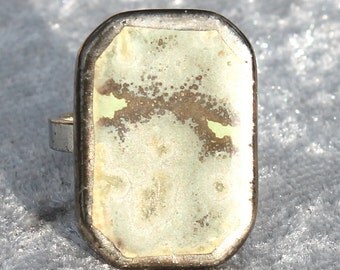 Pretty green ring of ceramics silver with spots.