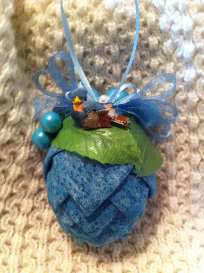 Blue fabric pinecone decoration.