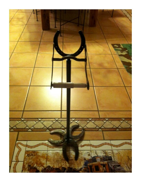 Standing toilet paper holder with removable horse bridle bit
