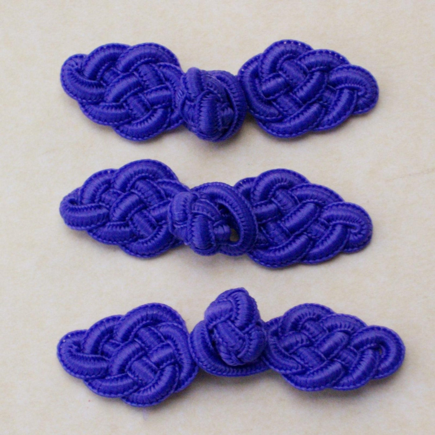 Bright purple frog closure. Celtic knot. Set by notionallybetter