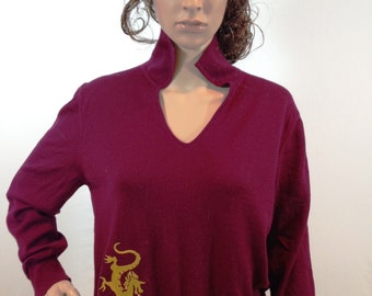 Maroon merino wool v-neck collared sweater embroidered with a gold dragon design. Size Large
