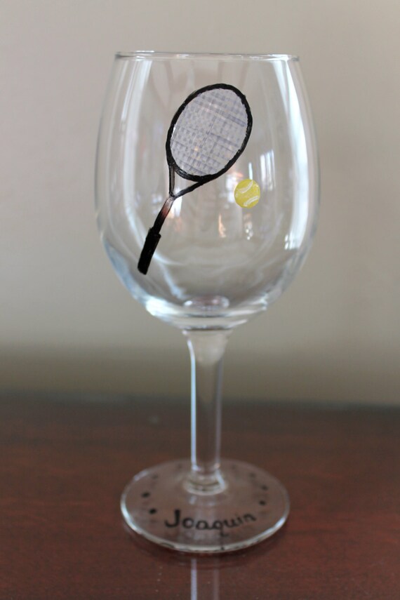 Tennis racquet and ball painted on a wine glass by CarlaniDesigns
