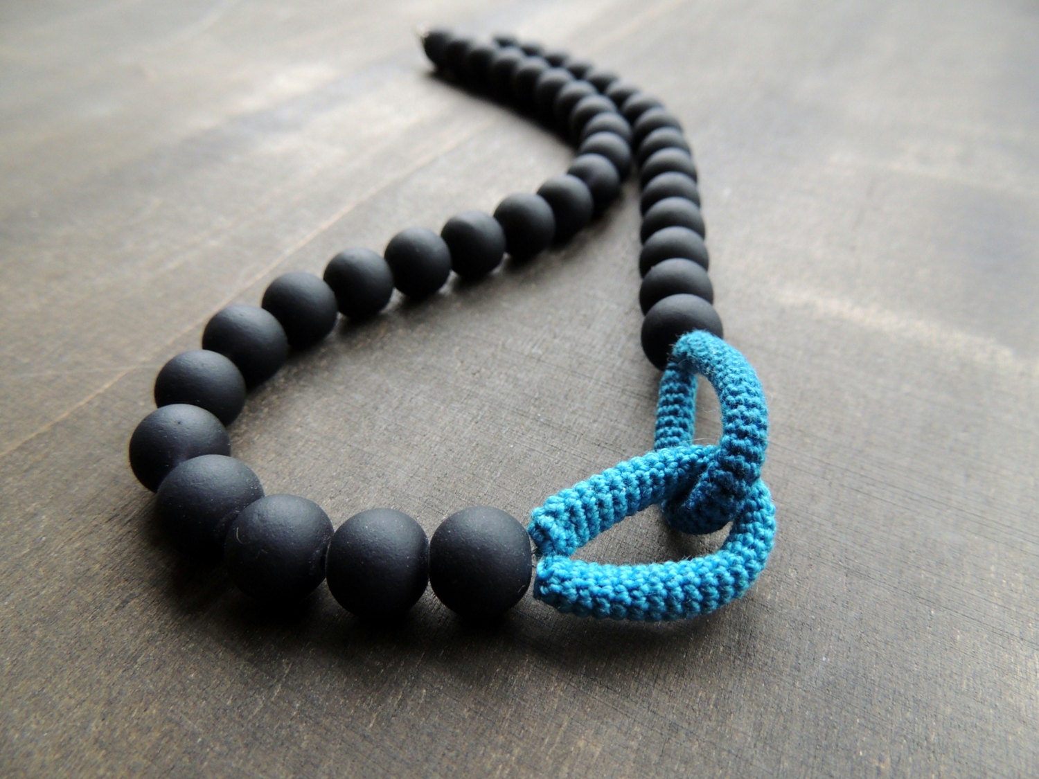 Matte black rubber coated glass beads beads pimped with