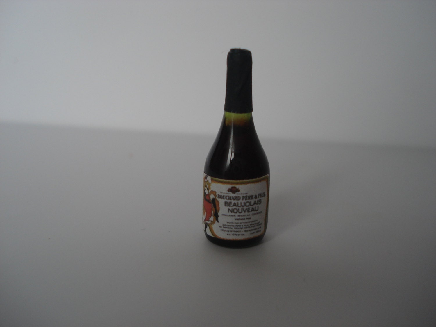 Miniature red wine glass bottle
