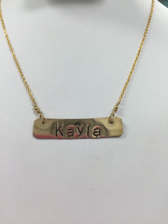 Items similar to Hand Stamped Gold/Brass Name Tag Necklace with Gold