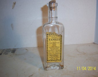 1920's Manning Vanilla Taunton, Mass 6 1/4 inch tall Clear food extract bottle with paper label